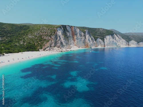 Drone view of Fteri beach, Kefalonia island, Greece. Clear turquoise waters of Ionian sea and rocky coastline