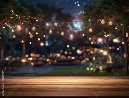 Empty Wood table top with decorative outdoor string lights hanging on tree in the garden at night time 