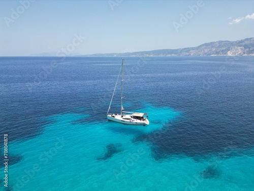 Drone view of the yacht sailing in the Ionian sea near Fteri beach, Kefalonia island, Greece photo