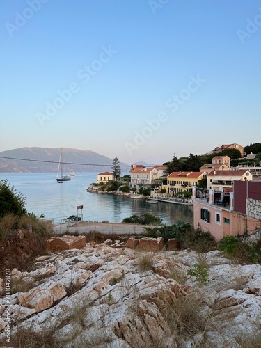 Fiskardo village at sunset time, Kefalonia Island, Greece. Greek Island architecture and yacht harbour