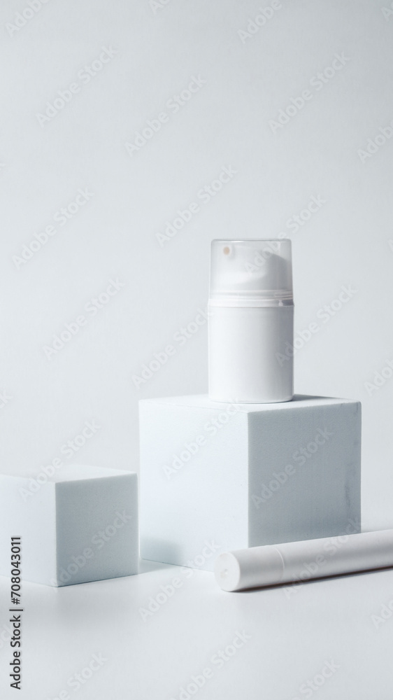 Luxury cosmetics on a white podium, mock up Luxury cosmetics on a white podium, mock up