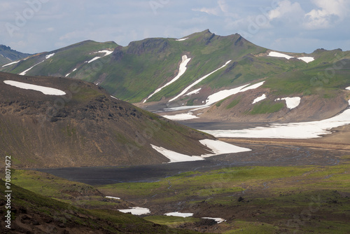 Summer mountain landscape. View of the volcano caldera. Travel and hiking on the Kamchatka Peninsula. Beautiful nature of Siberia and the Russian Far East. Gorely volcano, Kamchatka Territory, Russia. photo