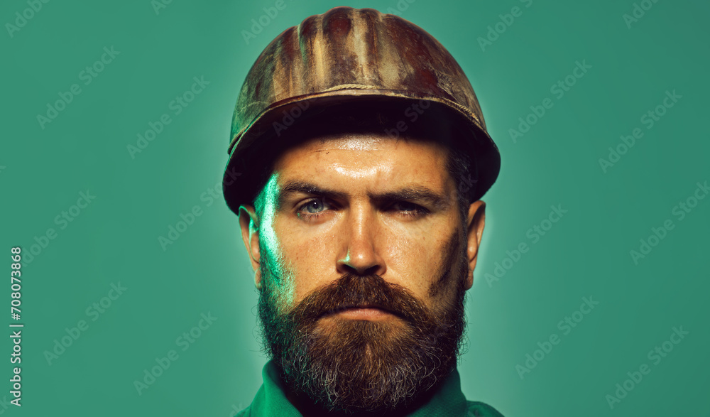 Closeup portrait serious bearded architect, civil engineer or designer in protective helmet. Industrial or mechanical worker in construction hardhat. Builder, foreman or repairman in safety hard hat. Closeup portrait serious bearded architect, civil engineer or designer in protective helmet. Industrial or mechanical worker in construction hardhat. Builder, foreman or repairman in safety hard hat.