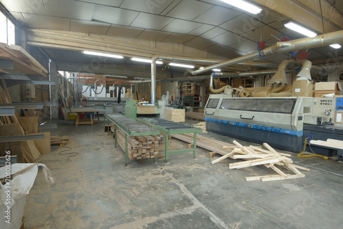 interior view of a carpentry industry with machinery and wood