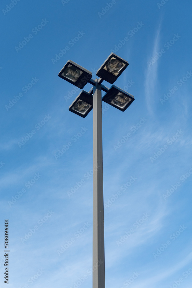 Outdoor parking lot light fixture against blue sky Outdoor parking lot light fixture against blue sky