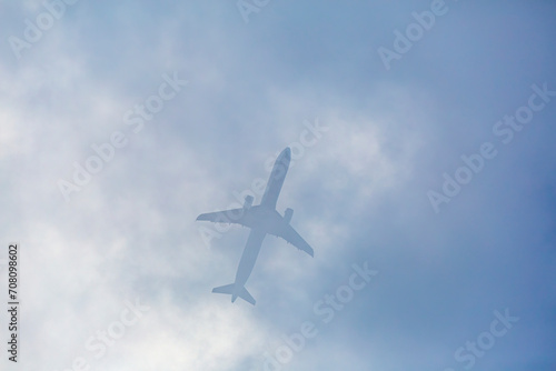Passenger plane passing through the clouds