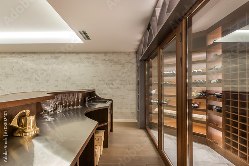 A special room in a private house with a collection of wines and a bar counter.