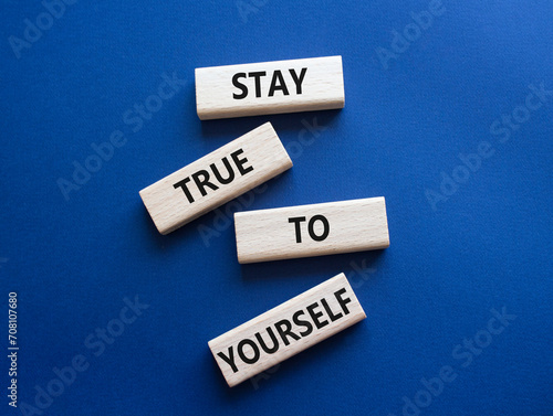 Stay True to Yourself symbol. Wooden blocks with words Stay True to Yourself. Beautiful deep blue background. Business and Stay True to Yourself concept. Copy space.