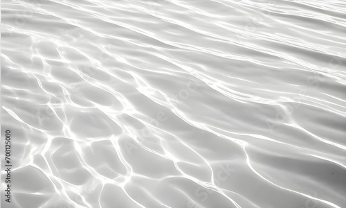 Closeup of desaturated transparent clear calm water surface texture with ripples and spots. Pure natural swirl pattern texture. Sea world in sunlight, copy space, top view. 