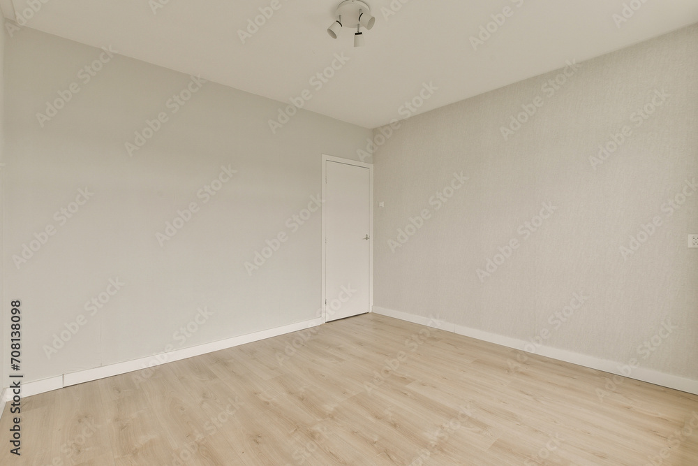 Minimalist empty room with wooden floor and neutral walls Minimalist empty room with wooden floor and neutral walls