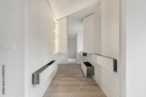 A dressing hallway that leads to an en-suite bathroom