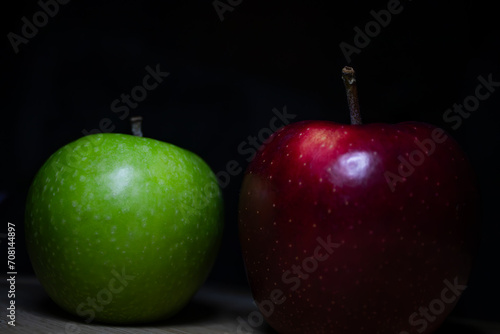 red and green apples on black