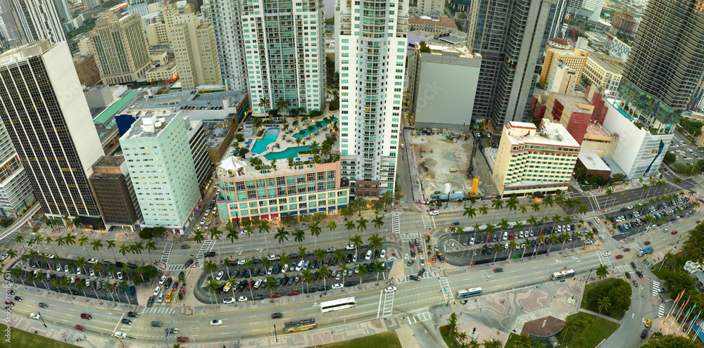 Aerial view of heavy traffic on urban street in downtown office district of Miami Brickell in Florida, USA. High commercial and residential skyscraper buildings in modern american megapolis Aerial view of heavy traffic on urban street in downtown office district of Miami Brickell in Florida, USA. High commercial and residential skyscraper buildings in modern american megapolis