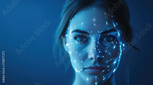 A woman's face glows under blue light, overlaid with glowing white biometric pattern lines, symbolizing futuristic facial recognition technology photo