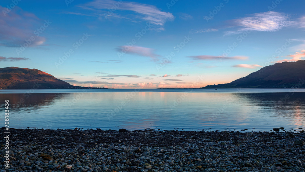 Beautiful sunset view from Warrenpoint. On the left, the Mourne Mountains in Northern Ireland and on the right the Cooley Mountains in Republic of Ireland Beautiful sunset view from Warrenpoint. On the left, the Mourne Mountains in Northern Ireland and on the right the Cooley Mountains in Republic of Ireland