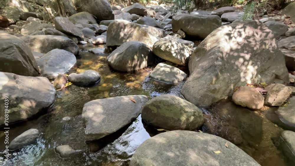 Natural stream and beautiful rocks in a tropical forest. 4k video. Natural stream and beautiful rocks in a tropical forest. 4k video.