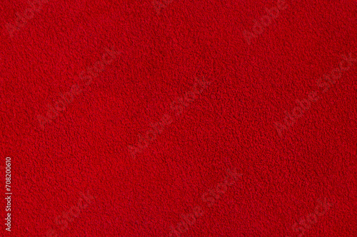 Red suede texture. Natural red dyed leather, suede macro photo.
