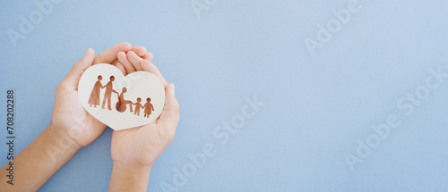 Hands holding diversity family in heart shape, happy carer and volunteer, disable nursing home, rehabilitation and health insurance concept photo
