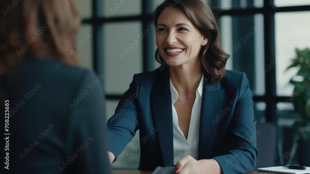 Happy mid aged business woman manager handshaking at office meeting. Smiling female hr hiring recruit at job interview, bank or insurance agent, lawyer making contract deal with client at work - obrazy, fototapety, plakaty 