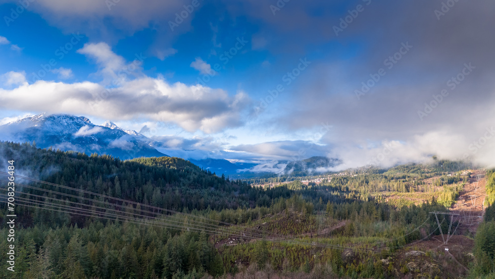Obraz premium Aerial View of Misty Mountain Landscape and Forest