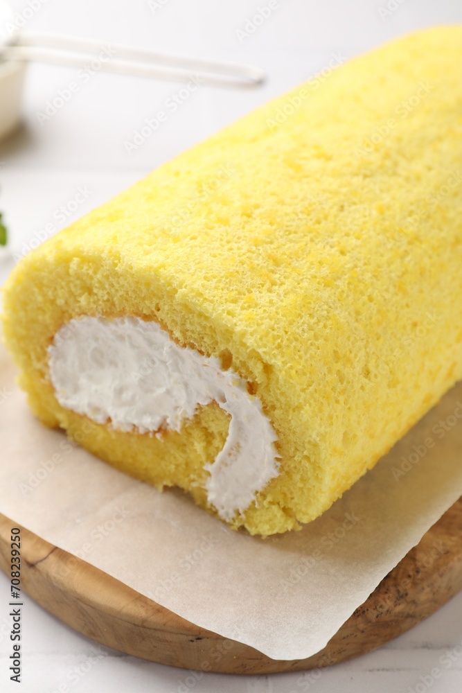 Delicious cake roll on table, closeup view