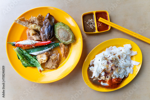 Overhead view of Yong tofu with chee cheong fun combination served in plate with sauces, popular street food in Malaysia photo