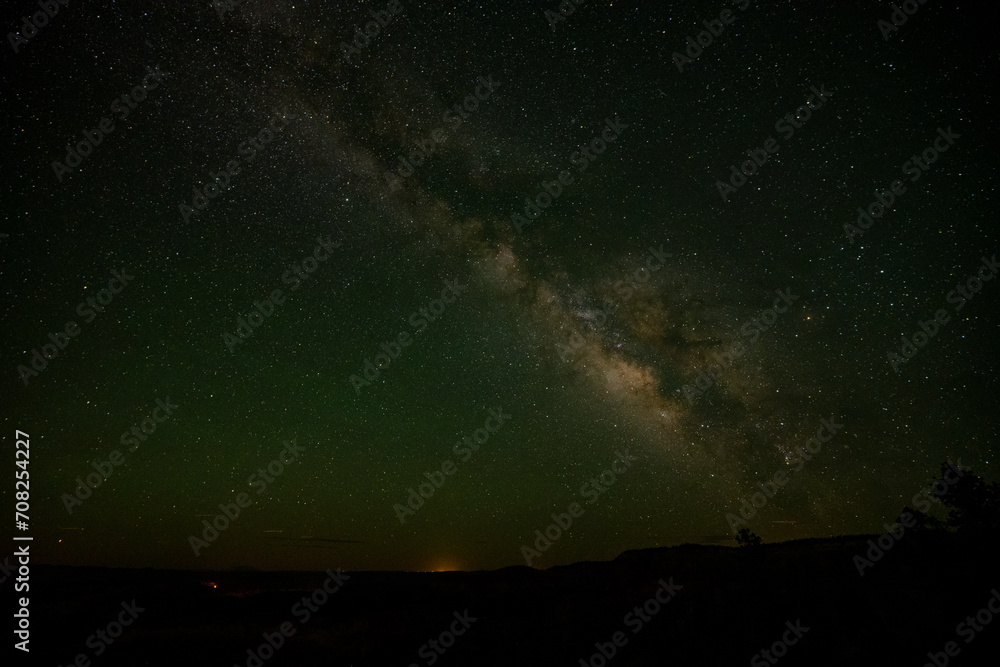 Faint City Lights On The Horizon Over Bryce Canyon With The Milky Way Over Head