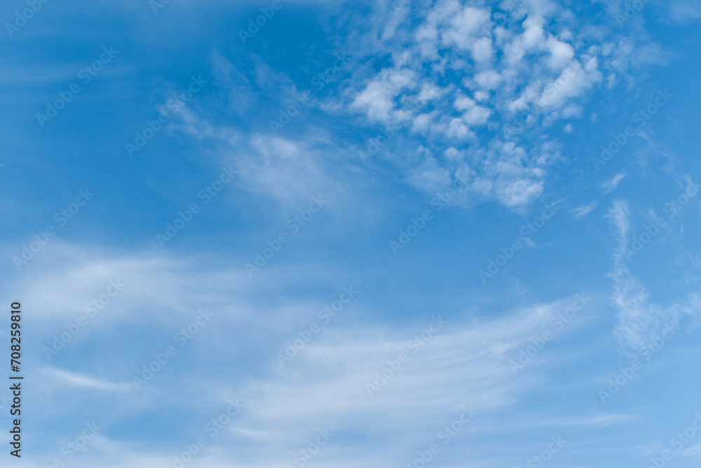 Blue sky with white clouds on a clear day. soft clouds background