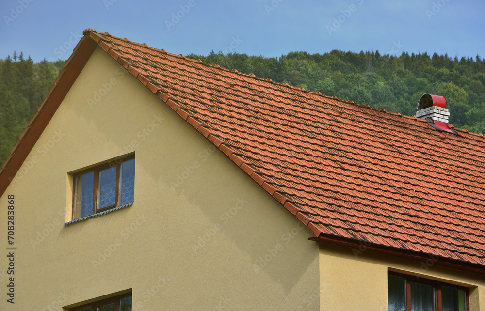 The roof of this square ceramic tile is red. The old type of roof covering in rich houses of the 19th century The roof of this square ceramic tile is red. The old type of roof covering in rich houses of the 19th century