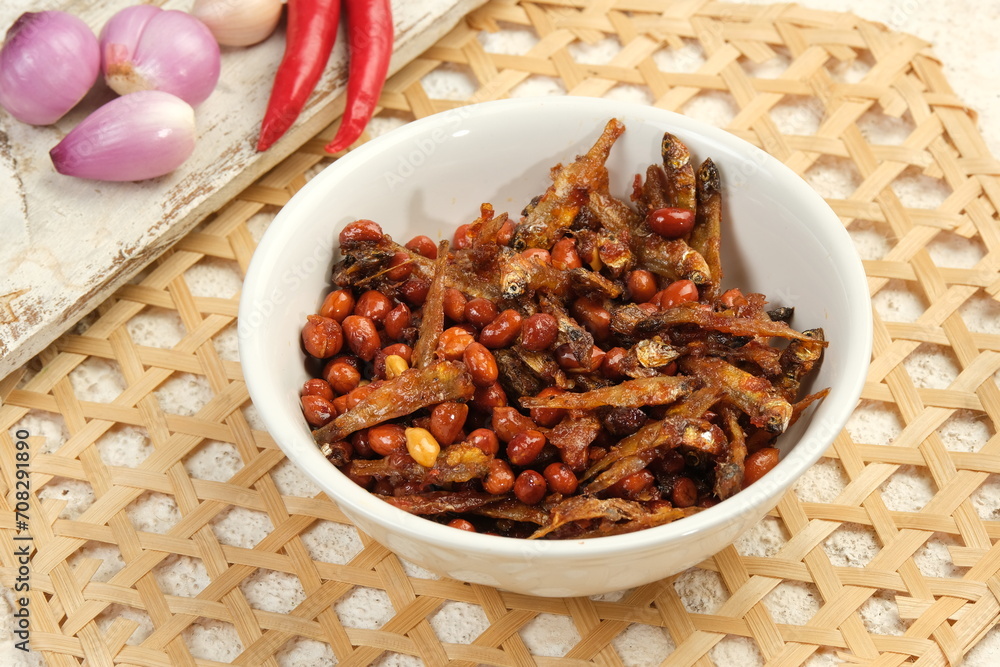 Sambal balado teri kacang is fried anchovy and peanuts with hot and spicy chili sauce.Traditional Indonesian food Sambal balado teri kacang is fried anchovy and peanuts with hot and spicy chili sauce.Traditional Indonesian food