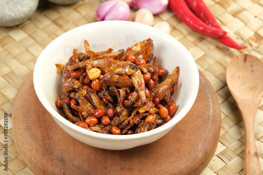 Fototapeta premium Sambal balado teri kacang is fried anchovy and peanuts with hot and spicy chili sauce.Traditional Indonesian food