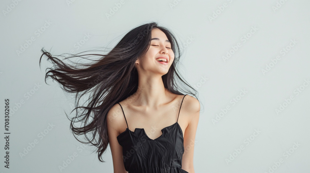 A Delightful Portrait of a Joyful Woman with Long Flowing Hair, Adorned in Chic Black Attire A Delightful Portrait of a Joyful Woman with Long Flowing Hair, Adorned in Chic Black Attire
