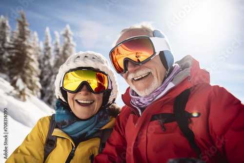 Portrait of seniors couple in ski resort wearing winter clothes. Active aging