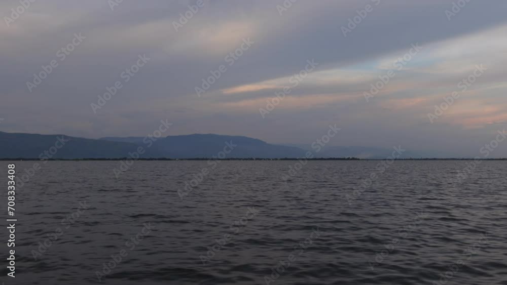 A view of the marsh water from a moving boat. Scenery of wetland water in Haor, Sunamganj, Bangladesh. A view of the marsh water from a moving boat. Scenery of wetland water in Haor, Sunamganj, Bangladesh.