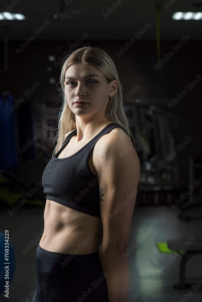 Portrait of a young beautiful girl working out in the gym. Portrait of a young beautiful girl working out in the gym.