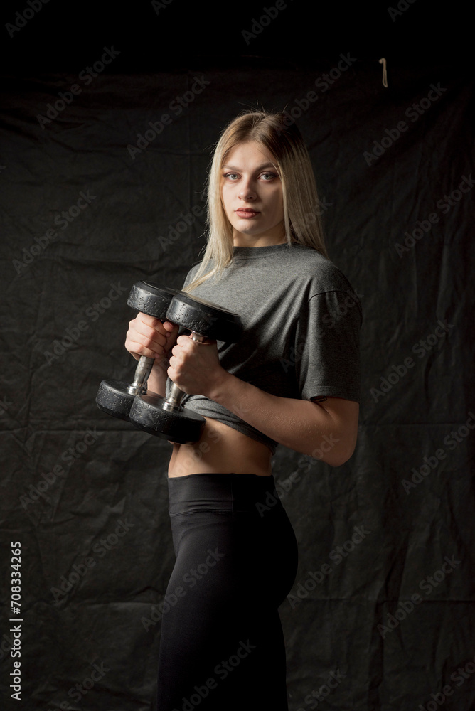 Portrait of a young beautiful girl working out in the gym. Portrait of a young beautiful girl working out in the gym.