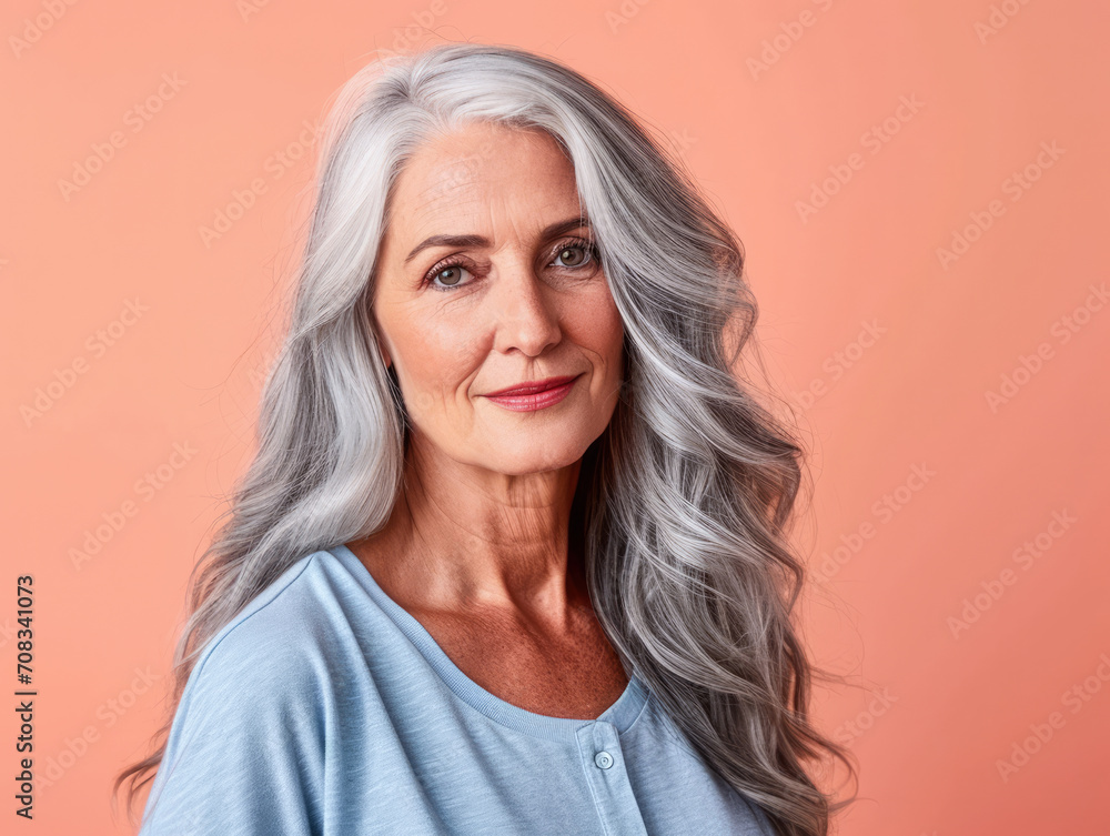 Close up of a confident middle aged woman with a peach copyspace background Close up of a confident middle aged woman with a peach copyspace background