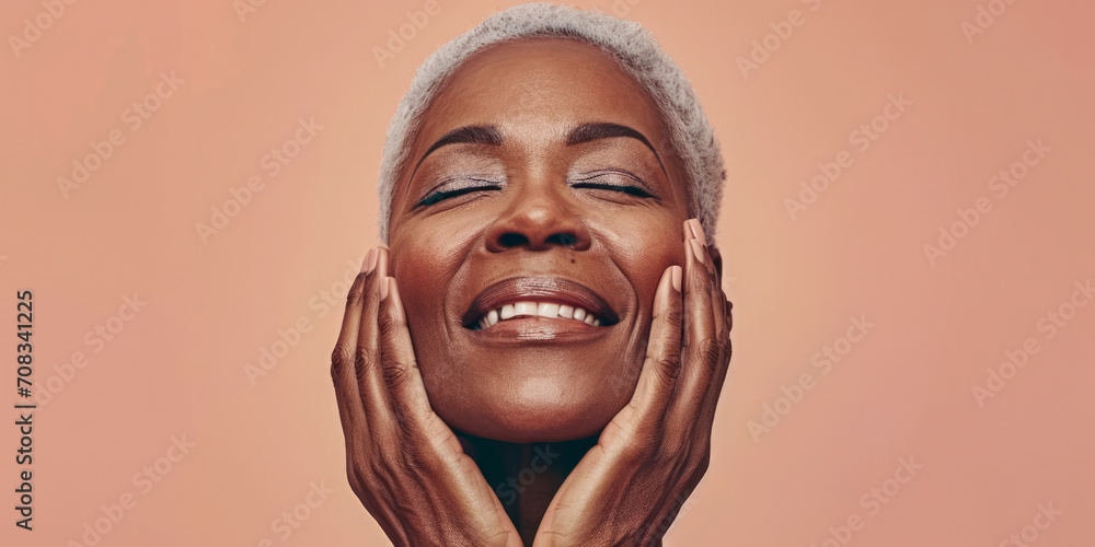 Close up of a confident middle aged woman with a peach copyspace background