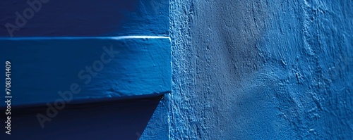 A Detail from a blue wall, close up of a corner of a house.  Mediterranean, Morocco, Caribs holidays, vacations, travelling concept. Space for text. AI generated image.  photo