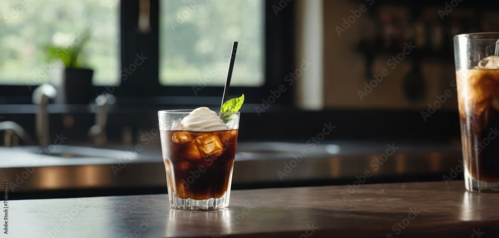 .The image shows a table with two glasses filled with iced tea. One of the glasses has a straw in it, and there is. .The image shows a table with two glasses filled with iced tea. One of the glasses has a straw in it, and there is.
