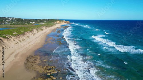 Aerial view, drone video of Fairhaven beach, Australia, Great Ocean Road. Beautiful coastline view of australian beach with lighthouse photo