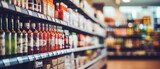Abstract blur image of Shopping mall with bokeh. Supermarket aisle and shelves blurred background. Blurred bright out of focus interior of a spacious open grocery store with neatly arranged shelves.