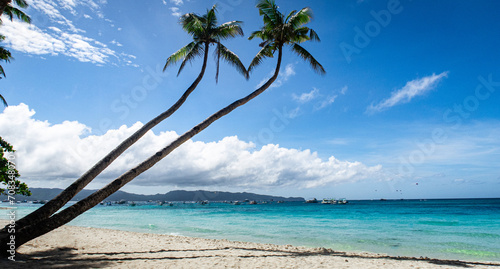 Coconut trees on a paradise white beach on Boracay Island Philippines  © Seb