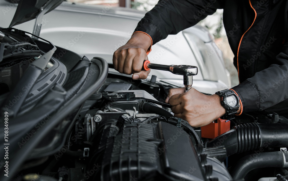 Mechanic fixing a car at home. Repair and service. Mechanic fixing a car at home. Repair and service.