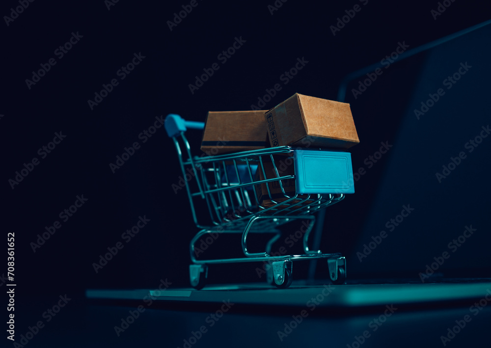 Boxes in a shopping car on a laptop keyboard. Ideas about online shopping, online shopping is a form of electronic commerce that allows consumers to directly buy goods from seller over the internet.