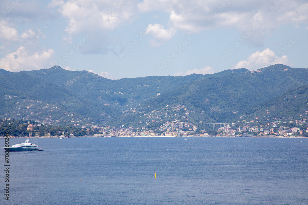 Portofino in Italy beautiful bay with yachts tourist liner with mountain panorama