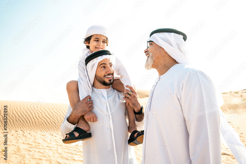 Three generation family making a safari in the desert of Dubai Three generation family making a safari in the desert of Dubai