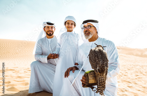 Three generation family making a safari in the desert of Dubai photo