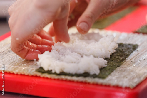 chef making sushi in restaurant