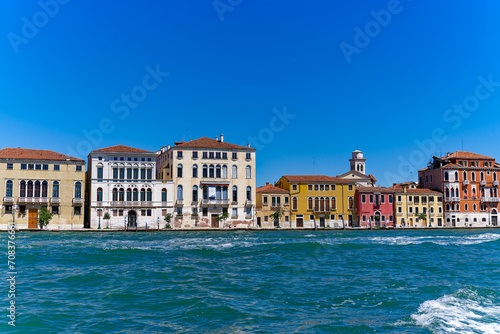 Old town of Italian City of Venice with colorful facades of historic houses seen from Canale san Giorgio on a sunny summer day. Photo taken August 7th, 2023, Venice, Italy. © Michael Derrer Fuchs